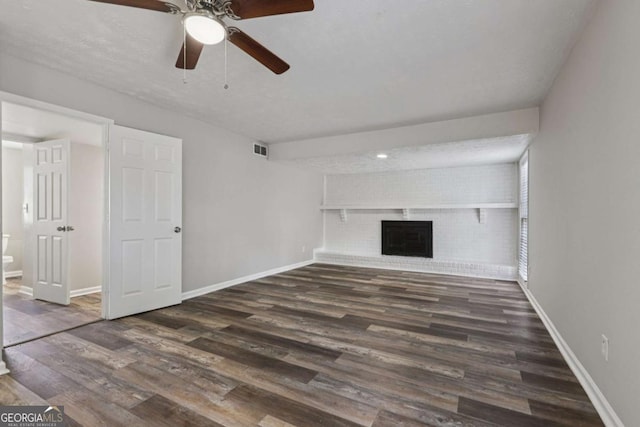 2849 Snapfinger Rd, Decatur, GA 30034 - unfurnished living room featuring wood finished floors, a ceiling fan, and a fireplace