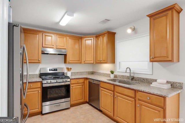 5807 Mitchell Chase Trl, Mableton, GA 30126 - kitchen featuring stainless steel appliances, under cabinet range hood, light stone countertops, and light tile patterned floors