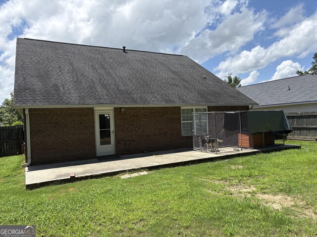 44 Hawk Spring Dr SW, Rome, GA 30165 - rear view of property featuring a shingled roof, brick siding, and a patio area