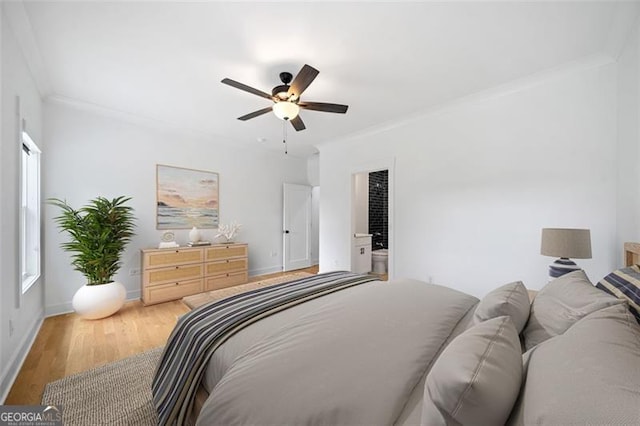 103 Maddox Rd, Buford, GA 30518 - bedroom with ornamental molding, wood finished floors, and a ceiling fan