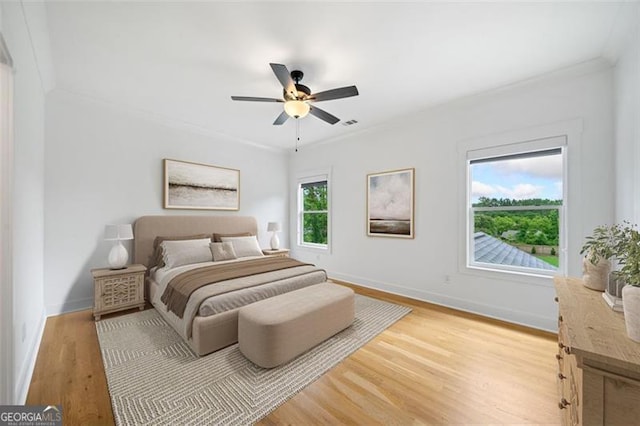 103 Maddox Rd, Buford, GA 30518 - bedroom featuring crown molding, light wood finished floors, and ceiling fan
