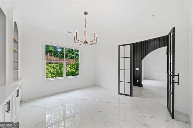 103 Maddox Rd, Buford, GA 30518 - empty room with a chandelier and light marble finish flooring