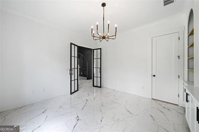 103 Maddox Rd, Buford, GA 30518 - unfurnished room featuring a chandelier, light marble finish floors, and crown molding