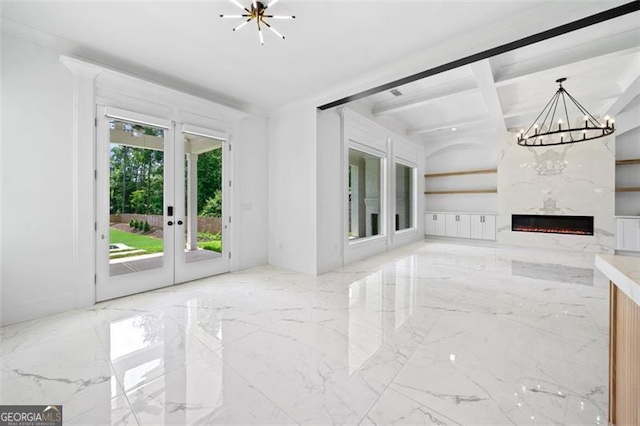 103 Maddox Rd, Buford, GA 30518 - unfurnished living room with a chandelier, coffered ceiling, a high end fireplace, french doors, and beam ceiling