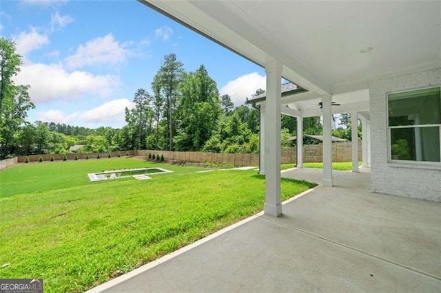 103 Maddox Rd, Buford, GA 30518 - fenced backyard with a patio area