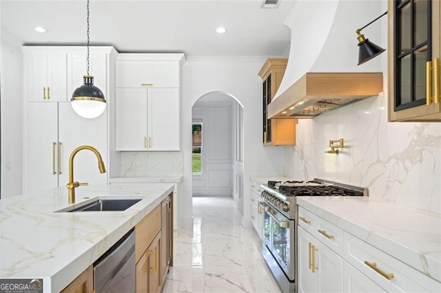 103 Maddox Rd, Buford, GA 30518 - kitchen featuring appliances with stainless steel finishes, wall chimney range hood, light marble finish floors, recessed lighting, and backsplash