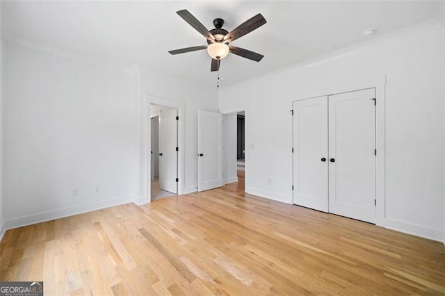 103 Maddox Rd, Buford, GA 30518 - unfurnished bedroom with light wood-style floors and a ceiling fan