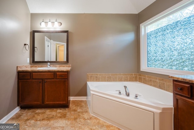 43 NE Yearling Ct, Ludowici, GA 31316 - bathroom with vanity and a garden tub