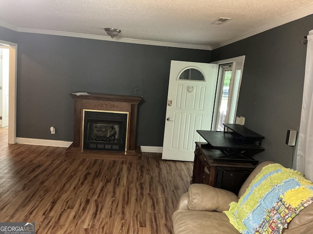 105 Tubb Rd, Chickamauga, GA 30707 - living room with wood finished floors, a fireplace with raised hearth, a textured ceiling, and crown molding
