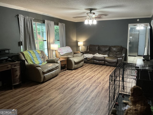 105 Tubb Rd, Chickamauga, GA 30707 - living room featuring a ceiling fan, a textured ceiling, wood finished floors, and crown molding
