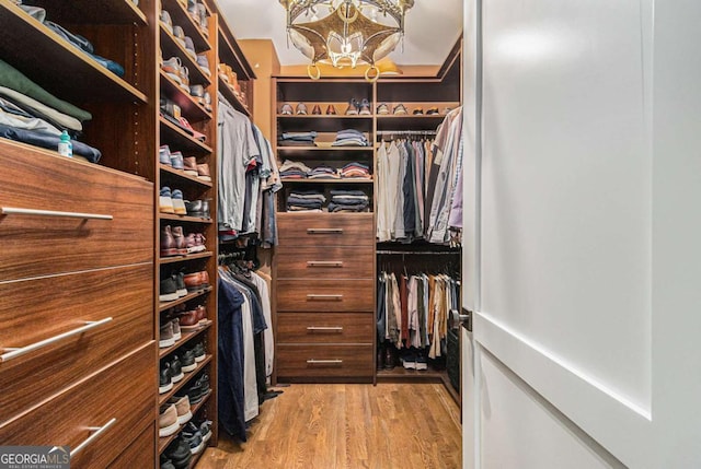 1833 N Rock Springs Rd NE, Atlanta, GA 30324 - spacious closet featuring wood finished floors and a chandelier