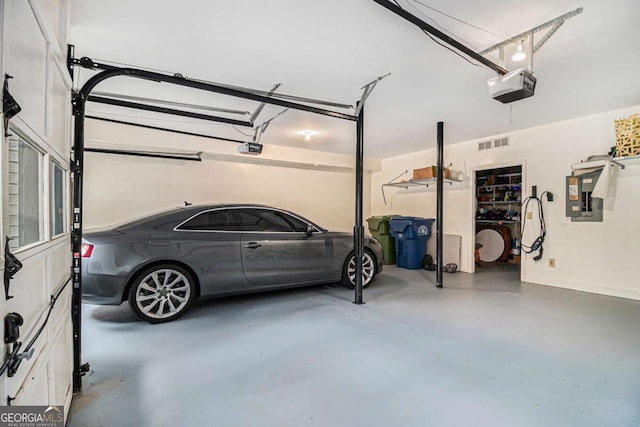 1833 N Rock Springs Rd NE, Atlanta, GA 30324 - garage featuring a garage door opener and electric panel