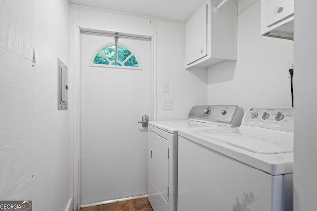 103 Fawn Ct, Eatonton, GA 31024 - laundry room with cabinet space, washing machine and clothes dryer, electric panel, and dark wood finished floors