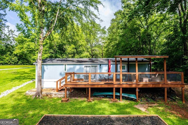 103 Fawn Ct, Eatonton, GA 31024 - rear view of property with a lawn and a wooden deck