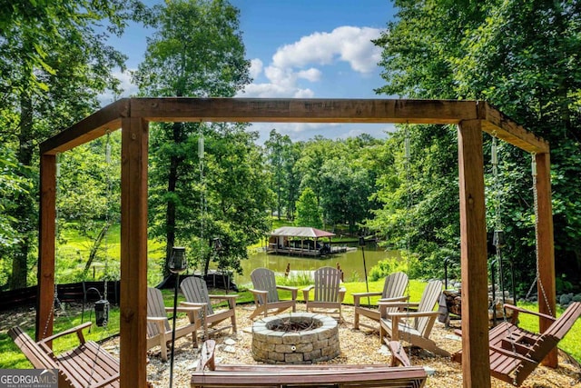 103 Fawn Ct, Eatonton, GA 31024 - view of patio with an outdoor fire pit and a water view
