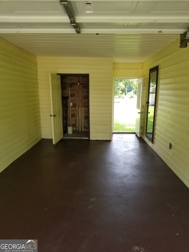 6617 18th St SW, Lanett, AL 36863 - unfurnished living room featuring concrete floors