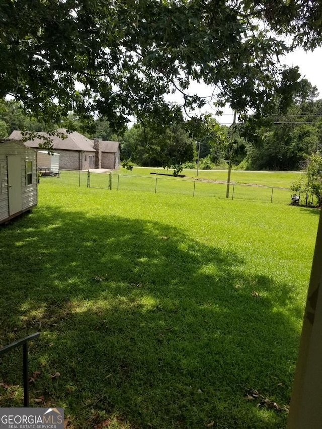 6617 18th St SW, Lanett, AL 36863 - view of yard with a storage unit