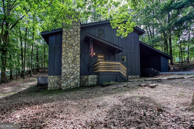101 Pawnee St, Waleska, GA 30183 - view of side of property featuring board and batten siding and a chimney