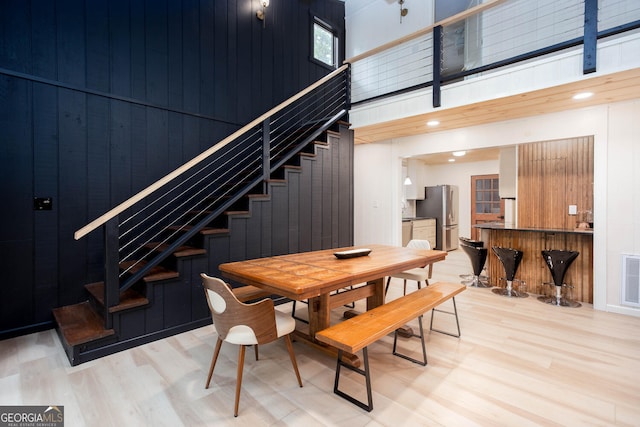 101 Pawnee St, Waleska, GA 30183 - dining space featuring light wood-style floors, stairs, and a high ceiling