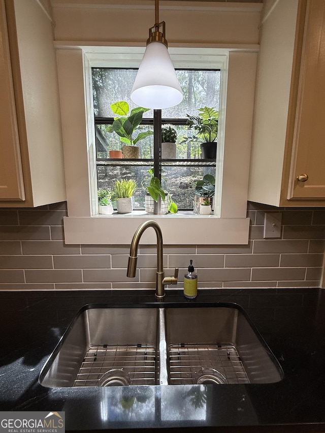 101 Pawnee St, Waleska, GA 30183 - kitchen view of dark countertops, decorative backsplash, and hanging light fixtures