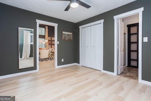 101 Pawnee St, Waleska, GA 30183 - unfurnished bedroom with light wood-style flooring, a closet, and ceiling fan