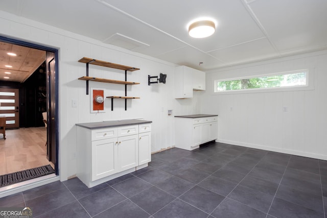 101 Pawnee St, Waleska, GA 30183 - kitchen with dark countertops, white cabinetry, dark tile patterned flooring, and open shelves
