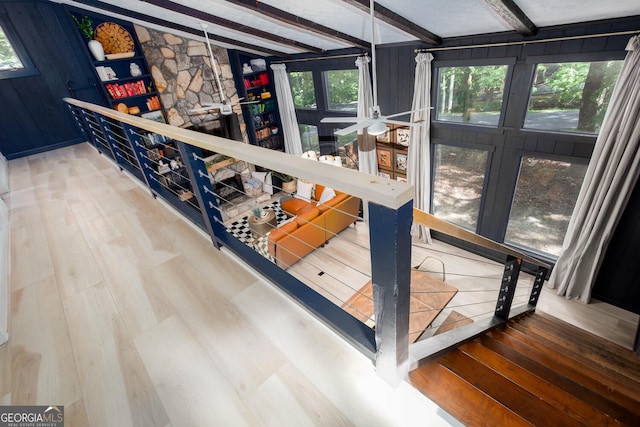 101 Pawnee St, Waleska, GA 30183 - staircase featuring healthy amount of natural light, wood finished floors, and beam ceiling