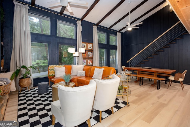101 Pawnee St, Waleska, GA 30183 - living area featuring a ceiling fan, stairs, wood walls, and wood finished floors