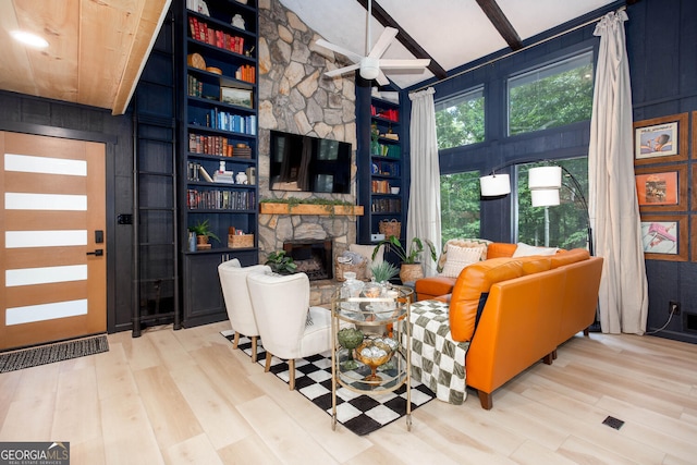 101 Pawnee St, Waleska, GA 30183 - living room featuring wood finished floors, a stone fireplace, and a ceiling fan