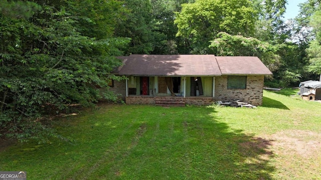 120 Foothill Dr, Dalton, GA 30720 - ranch-style house featuring a porch, brick siding, and a front yard