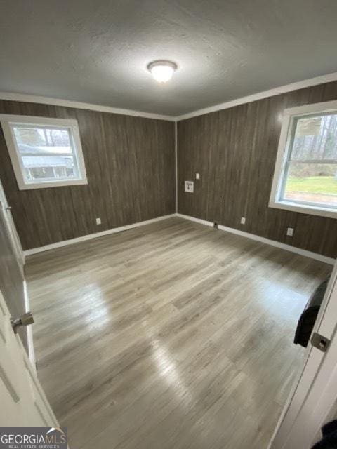 120 Foothill Dr, Dalton, GA 30720 - unfurnished room with wood finished floors, wood walls, and a textured ceiling