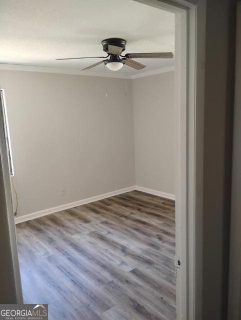 120 Foothill Dr, Dalton, GA 30720 - empty room featuring crown molding, wood finished floors, and a ceiling fan
