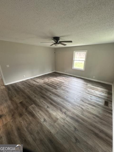 120 Foothill Dr, Dalton, GA 30720 - spare room with dark wood-style flooring, ceiling fan, and a textured ceiling