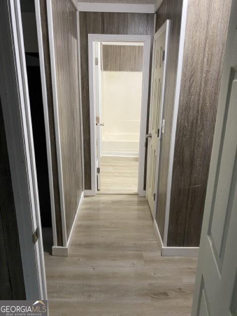 120 Foothill Dr, Dalton, GA 30720 - hall with wooden walls and light wood-style floors
