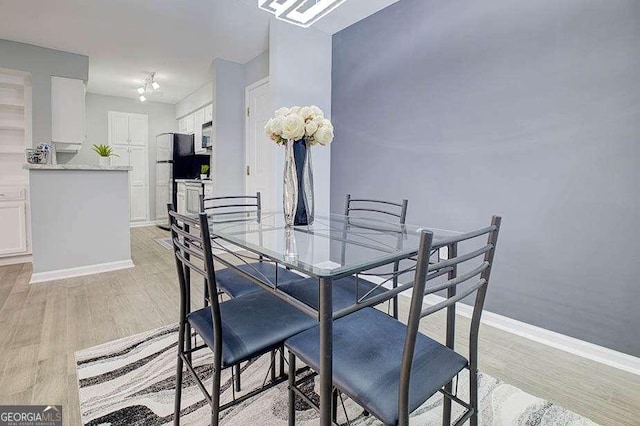 24317 Plantation Dr NE, Atlanta, GA 30324 - dining room featuring light wood finished floors