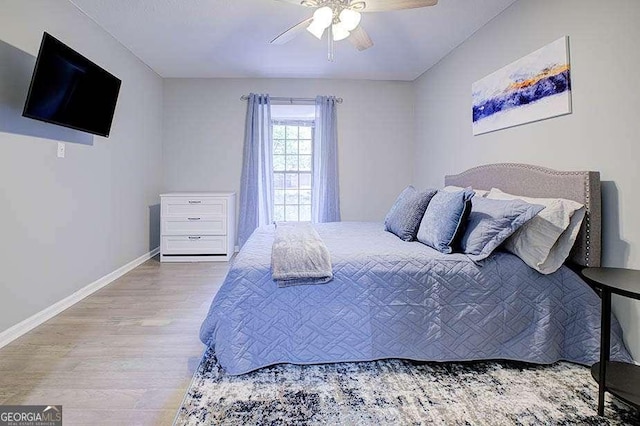 24317 Plantation Dr NE, Atlanta, GA 30324 - bedroom featuring wood finished floors and ceiling fan