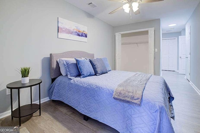 24317 Plantation Dr NE, Atlanta, GA 30324 - bedroom featuring wood finished floors and a ceiling fan