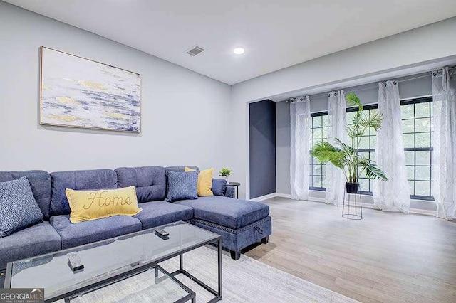 24317 Plantation Dr NE, Atlanta, GA 30324 - living room with wood finished floors and recessed lighting