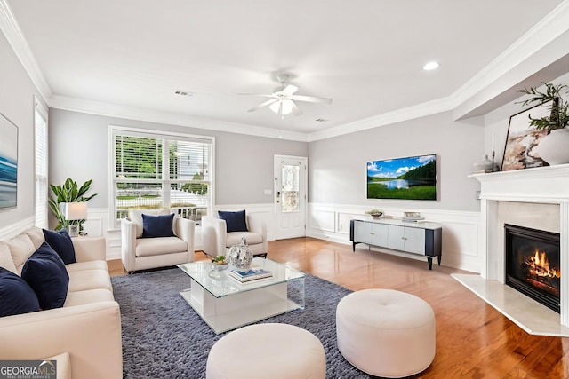 3725 Downing Dr, Cumming, GA 30040 - living room featuring a ceiling fan, a premium fireplace, a wainscoted wall, recessed lighting, and wood finished floors