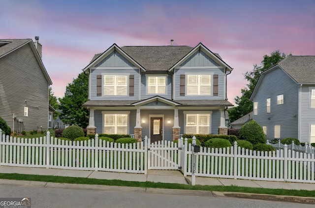 3725 Downing Dr, Cumming, GA 30040 - craftsman-style house with a fenced front yard, board and batten siding, a gate, and a shingled roof