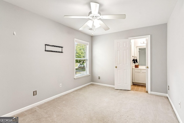 3725 Downing Dr, Cumming, GA 30040 - unfurnished bedroom featuring light carpet, ensuite bath, and a ceiling fan