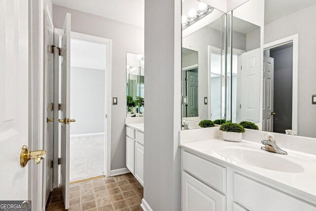 3725 Downing Dr, Cumming, GA 30040 - bathroom featuring vanity and baseboards