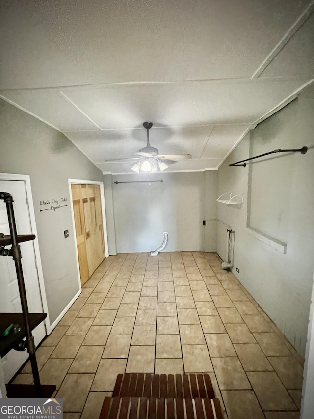 319 N Line St, Dexter, GA 31019 - empty room with ceiling fan and light tile patterned flooring