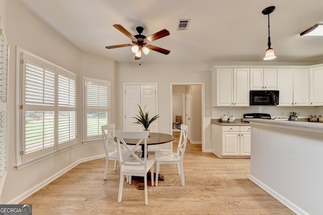 1868 Birch Briar Bnd, Lawrenceville, GA 30043 - dining area with ceiling fan and light wood finished floors