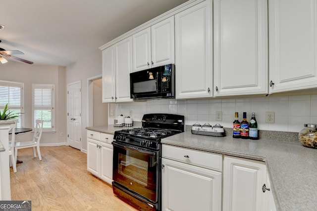 1868 Birch Briar Bnd, Lawrenceville, GA 30043 - kitchen featuring black appliances, a ceiling fan, light wood-style flooring, decorative backsplash, and white cabinetry