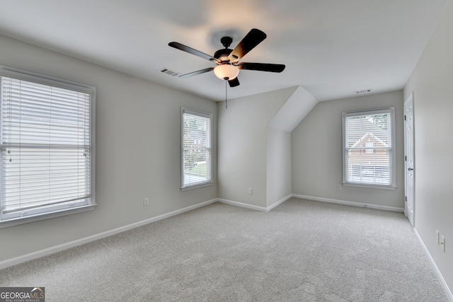 1868 Birch Briar Bnd, Lawrenceville, GA 30043 - additional living space with healthy amount of natural light, a ceiling fan, and light carpet