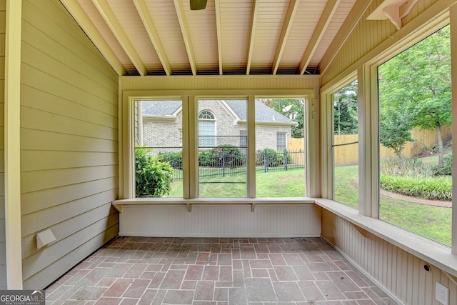 1868 Birch Briar Bnd, Lawrenceville, GA 30043 - unfurnished sunroom with brick floors, wood walls, and healthy amount of natural light