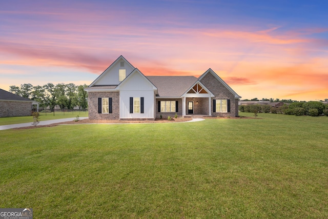 3 Honeysuckle Dr, Claxton, GA 30417 - modern farmhouse style home with brick siding, a front lawn, and a shingled roof