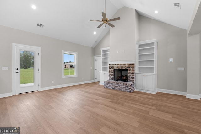 3 Honeysuckle Dr, Claxton, GA 30417 - unfurnished living room with a ceiling fan, high vaulted ceiling, light wood-type flooring, recessed lighting, and a brick fireplace