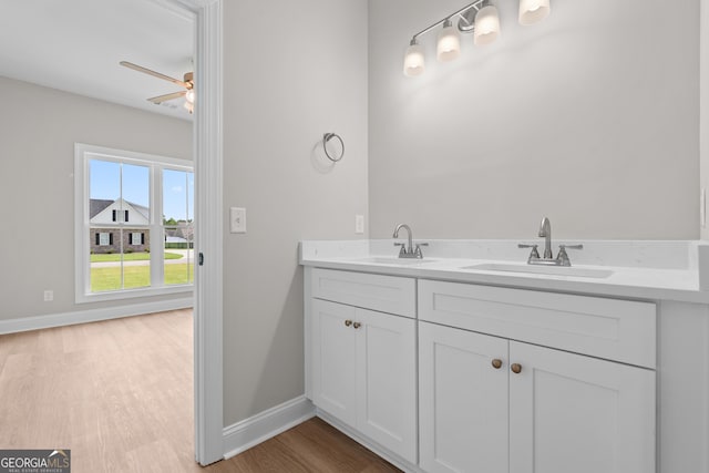 3 Honeysuckle Dr, Claxton, GA 30417 - bathroom featuring wood finished floors, double vanity, and ceiling fan